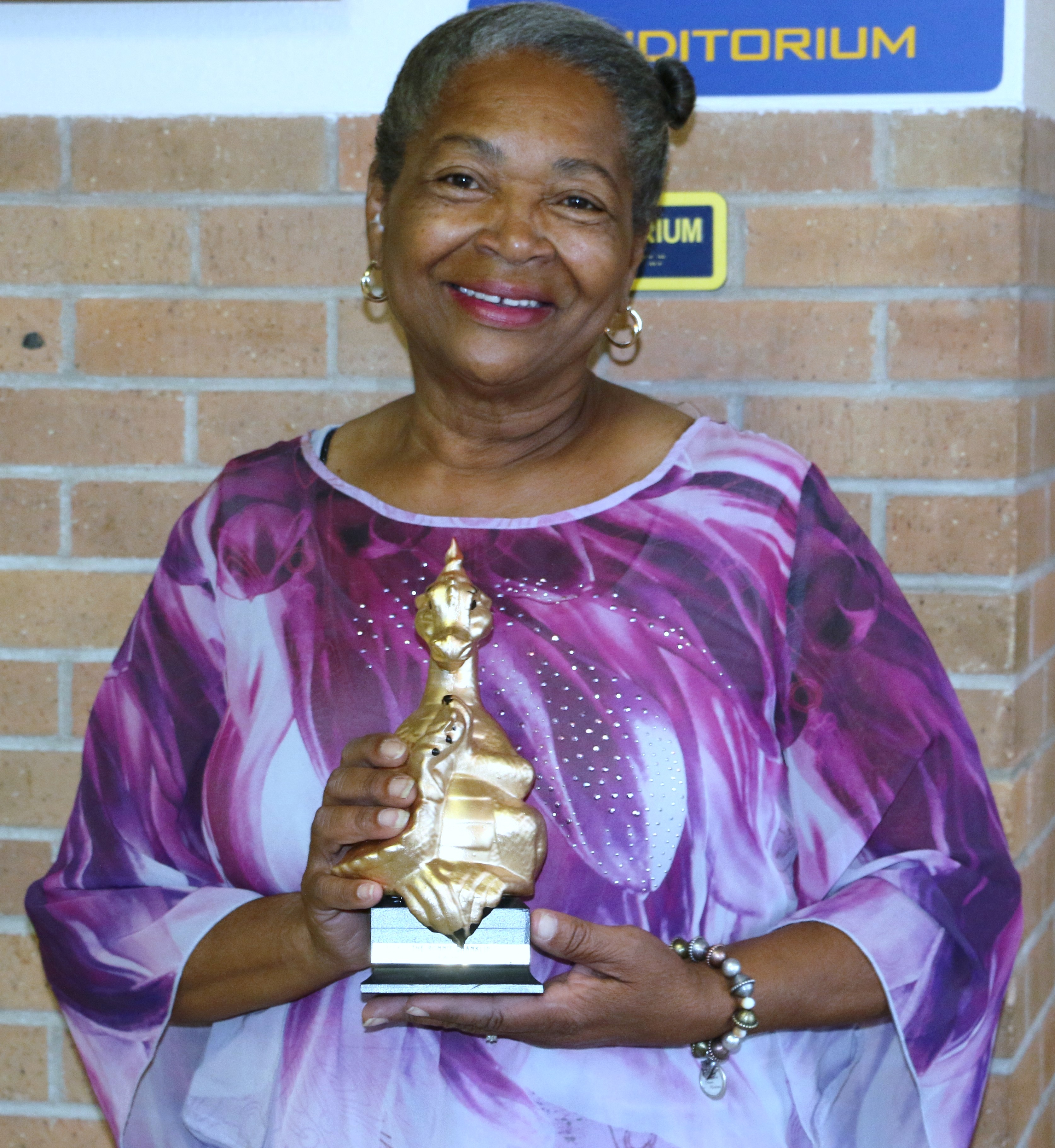 Ms. Patsy Swain accepted The Ronnie Shanklin Award for Mrs Gwen Parker-Harris daughter of Mr. Henry Parker.